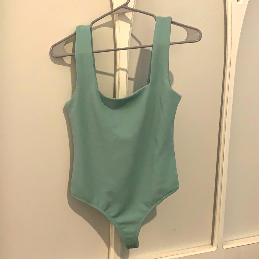 Pink lily bodysuit never worn